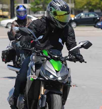 military motorcycle riders participating in road training class